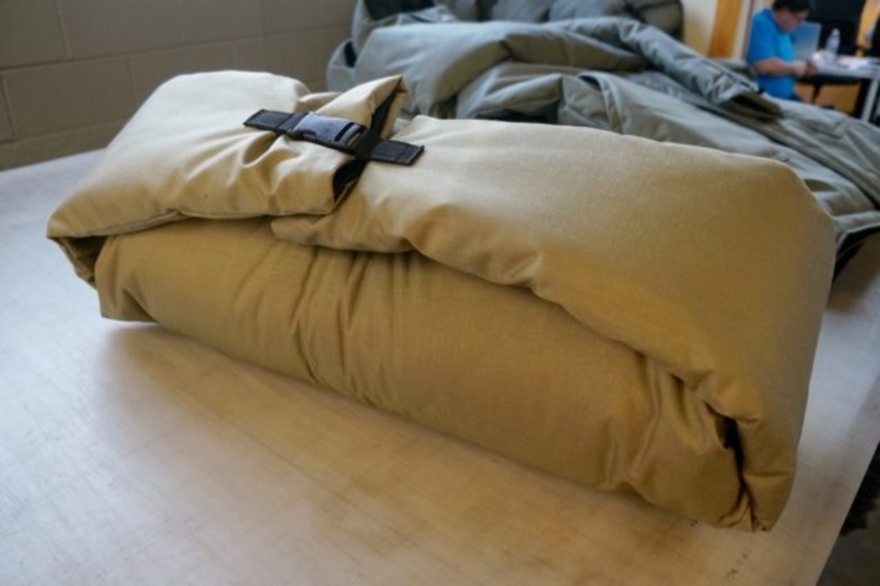 The EMPWR coat rolls out into a sleeping bag to keep homeless people