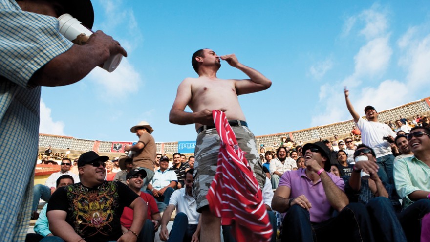 A spectator mocks the matador at a bullfighting match after disgracefully failin