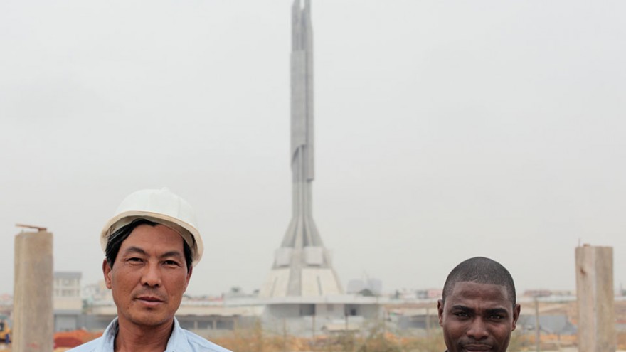 Chinese construction workers and Angolan interpreter outside the Mausoléu Agosti