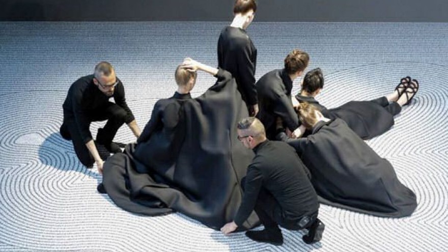 Viktor&Rolf’s fashion show for its 2013 collection – rather than the collection itself – was chosen in the fashion category.  In the first couture show by the label in 13 years the models, wearing flat sandals and high-necked, often loose-fitting dresses with asymmetrical bulges, were arranged on the ramp to resemble a living Zen garden. Seated in portrait and landscape poses, they created a serene performance. 