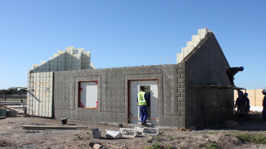 Formwork removed to reveal house structure. 