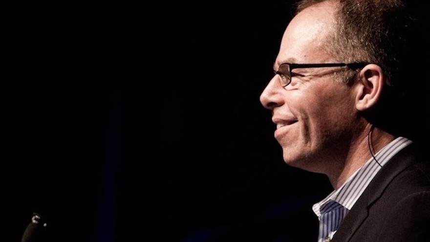 Michael Bierut on stage at the 2010 Design Indaba Conference, the last time he gave a presentation at the event. Since 2010, he has been the Conference co-emcee. 