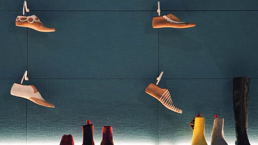 Tascón's two new shoe stores in Barcelona are contemporary in look, monochromatic in colour and use old shoe lasts to decorate the walls. Photo curtesy of Albert Font.