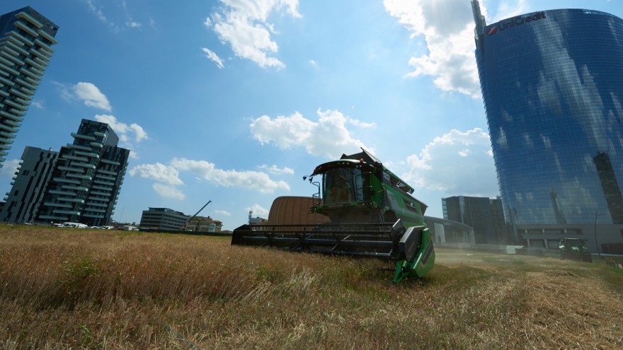 Traditional tools and modern devices were used to reap the wheat.