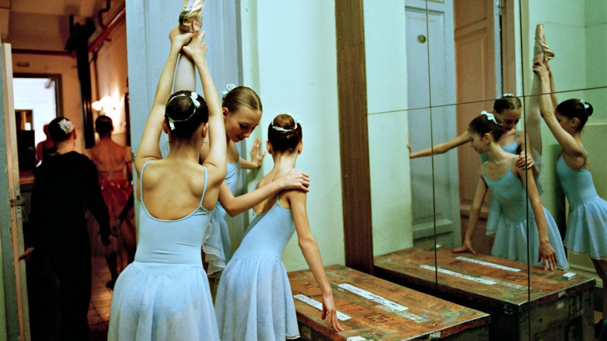 Trio of dancers in front of mirror