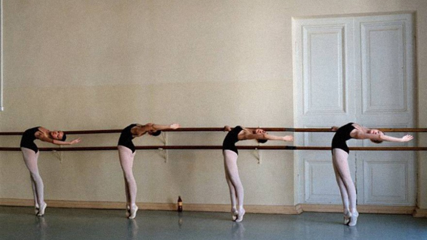 A group of dancers at the barre