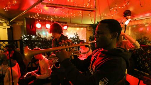 Jo Lanre Kunnuji on the trumpet at a performance. 