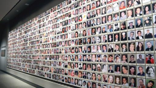 Wall of photos as 9/11 Memorial Museum. 