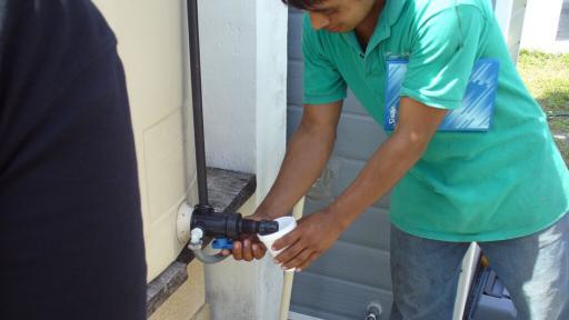 A villager uses MIT's solar powered system. Picture courtesy of MIT 