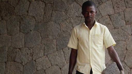 "What makes me happy is that people in this neighbourhood tell me I have done something beautiful here. I will build my house with this stone." Master Mason Hakiza Emmanuel worked on the volcanic stone facades of the Butaro Hospital, Rwanda