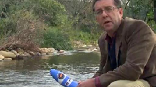 Professor Eugene Cloete with tea bag water filter. 