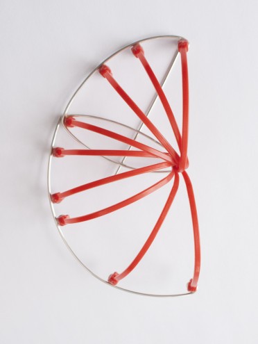 A brooch by Sarah Rhodes as part of the early exploratory process of working with cable ties.