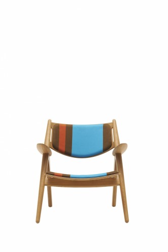 Paul Smith redesigns Carl Hansen & Son's iconic Shell Chair in collaboration with Maharam. 