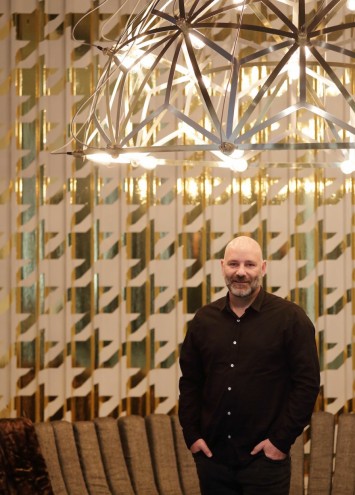 Haldane Martin underneath his new Tesla Chandelier at the LEON At CCIX showroom. Image: Henk Hatting.