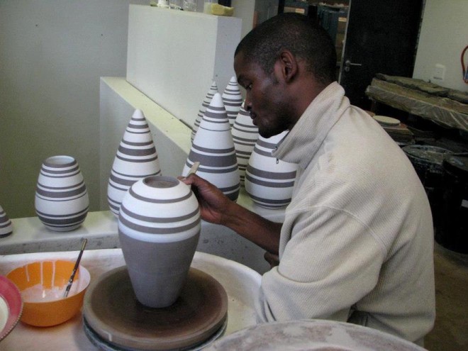 Ceramicist Chuma Maweni works on his tear drop canisters at Art In The Forest in Constantia.