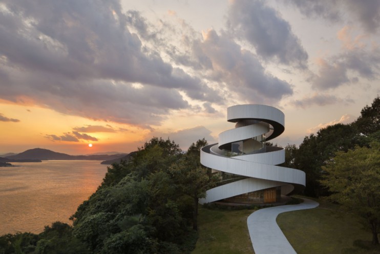 Japanese architect Hiroshi Nakamura designed the Ribbon Chapel – a structure wrapped in double spiral stairways with striking views of the ocean and islands.