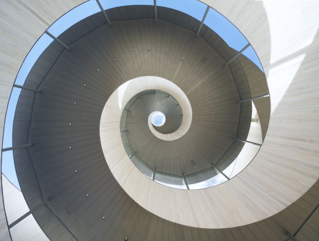 Japanese architect Hiroshi Nakamura designed the Ribbon Chapel – a structure wrapped in double spiral stairways with striking views of the ocean and islands.