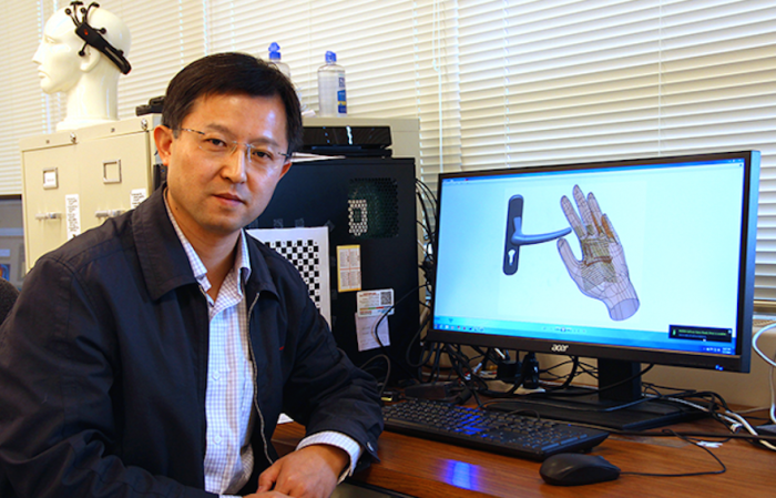 hand-worn robotic device to help the blind