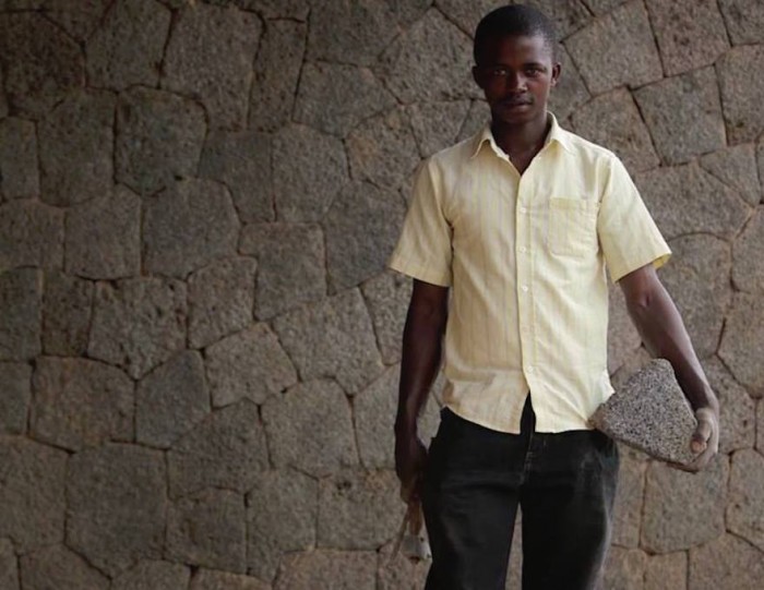 "What makes me happy is that people in this neighbourhood tell me I have done something beautiful here. I will build my house with this stone." Master Mason Hakiza Emmanuel worked on the volcanic stone facades of the Butaro Hospital, Rwanda