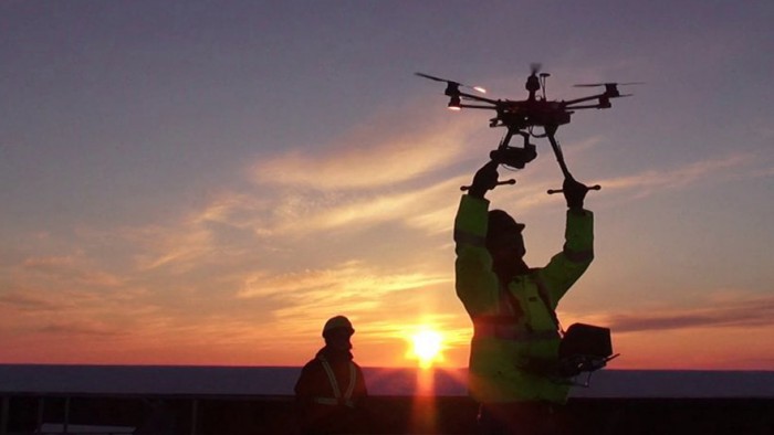 Operator letting go of a drone for testing