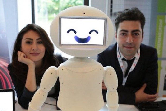 LuxAI's robot with Aida Nazariklorram, co-founder and Chief Medical Officer, and Dr. Pouyan Ziafati, founder and CEO