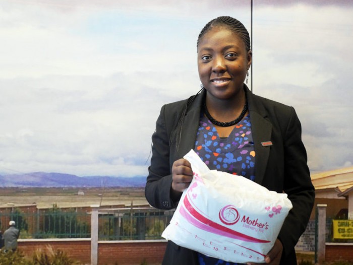Picture via Path.org Adepeju Jaiyeoba holding a Mother's Delivery Kit