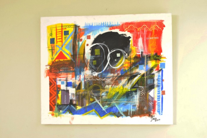 Africa & Patterns created using blue, red, yellow and black paint color.