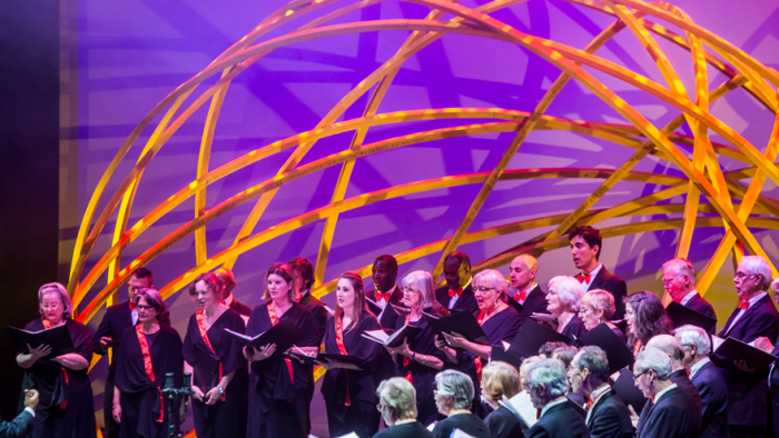 Choir singing under Arch structure