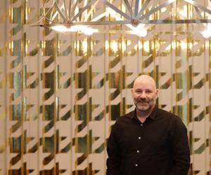 Haldane Martin underneath his new Tesla Chandelier at the LEON At CCIX showroom. Image: Henk Hatting. 