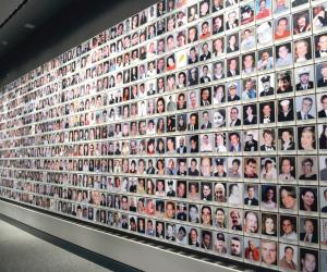 Wall of photos as 9/11 Memorial Museum. 