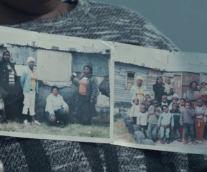 Principal of Three Sisters Educare holds up photos of the tiny shack where she started the school with 10 children.