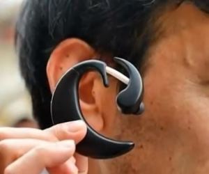 A PC worn in the user's ear.