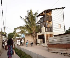 Casas Melhoradas, a double storey, low-cost house by Architects Without Borders, reinterprets Mozambique’s traditional corrugated iron and wood homes.