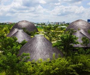 Vietnamese studio Vo Trong Nghia Architects have constructed eight thatched-roof domes that serve as a multi-functional community centre.