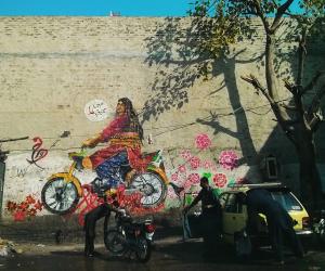 In Rawalpindi, the collective painted Bubbli Mallik, a Khwaja-sira (transgender person) riding a motorcycle. 