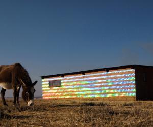 South African-based artist r1 used 1000 recycled CDs to clad an abandoned farmhouse in Randfontein, a mining city in western Gauteng. 