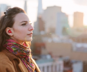 Furturistic earpiece translates conversations in real-time.
