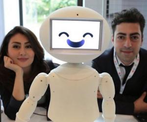 LuxAI's robot with Aida Nazariklorram, co-founder and Chief Medical Officer, and Dr. Pouyan Ziafati, founder and CEO