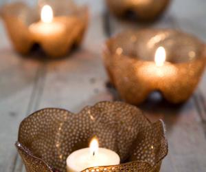 Candle holders made from brown plastic bottles. 