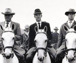 The commando of National Party stalwarts which escorted prime minister and National Party leader Hendrik Verwoerd and his wife Betsie to the party's 50th anniversary celebrations at de Wildt, Transvaal. Image: David Goldblatt. 