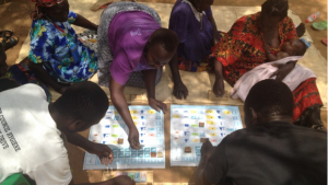 As Africa’s poorest go from aid to trade, Design without Borders and the UN’s World Food programme are helping a group of Ugandans to become truly self-reliant with the Aki Financial Literacy kit.