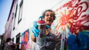 Urban Art Workshops for Seniors is a programme that is putting spray cans in the hands of Lisbon's pensioners, who are now part of a group called Lata 65. Photo credit Rui Soares