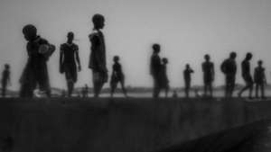 Runaway talibes stand on the bank of Senegal river, in Saint Louis city, north of Senegal, May 20, 2015. 