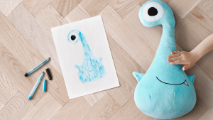 Blue monster with original drawing