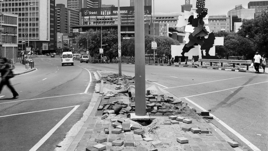 The City, The Firewalker and the aftermath of copper cable theft. Queen Elizabeth bridge, Johannesburg, 29 December 2011. Image: David Goldblatt. 