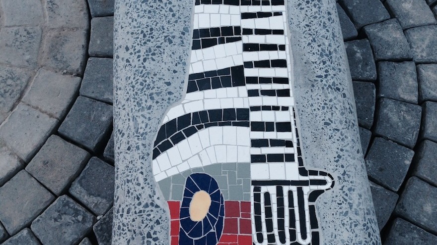 Running down the length of Shortmarket Street is an interrupted concrete bench, the form of which echoes the bold signature lines of the artist, Paul du Toit. This bench is to have a mosaic insert, and is to be part of the Rock Girl initiative: safe urban spaces.