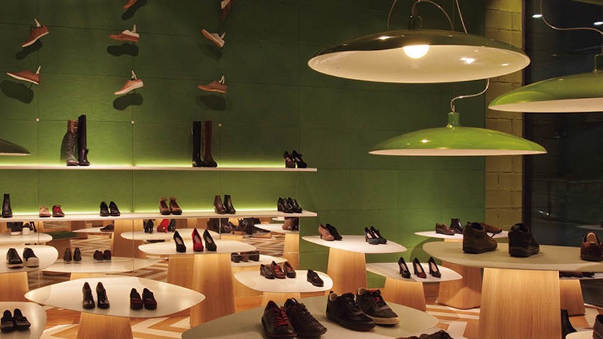 Tascón's two new shoe stores in Barcelona are contemporary in look, monochromatic in colour and use old shoe lasts to decorate the walls. Photo curtesy of Albert Font.