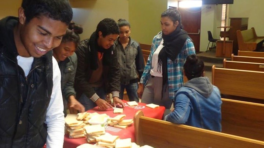 Daniel Engelbrecht helped young people at the NAC Strandfontein Village Youth church group distribute sandwiches, beanies and scarves to their local community.