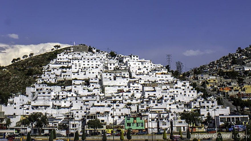 Germen Crew painted the entire area white before adding the rainbow mural to the houses. 