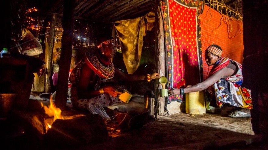 Nroti Lekiluai drinks tea inside Rose Lekanta’s house.